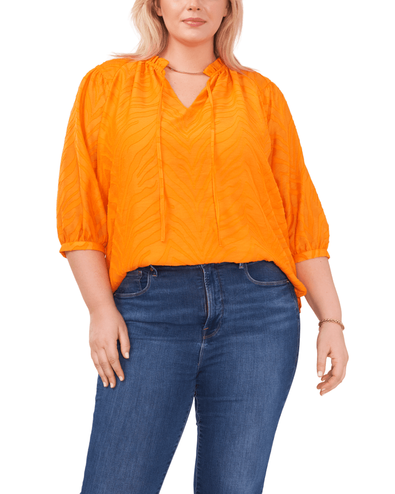 Front of a model wearing a size 1X Serenity Puff Sleeve Blouse in SUNSET ORNG by Vince Camuto. | dia_product_style_image_id:261255